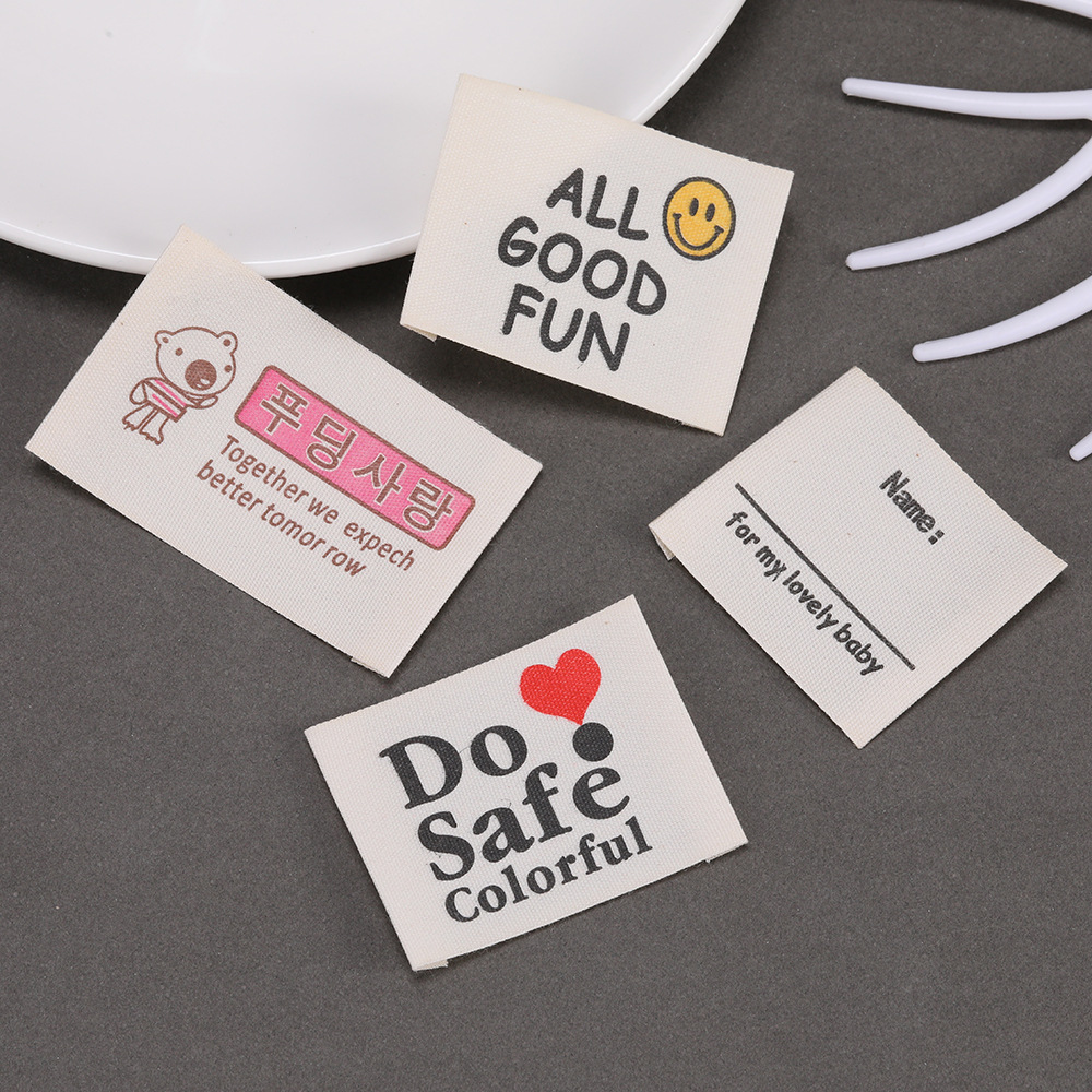 カスタムプリントプライベートロゴラベル、縫い付けコットンラベ - Baby Clothing Organic Cotton のレビューと価格