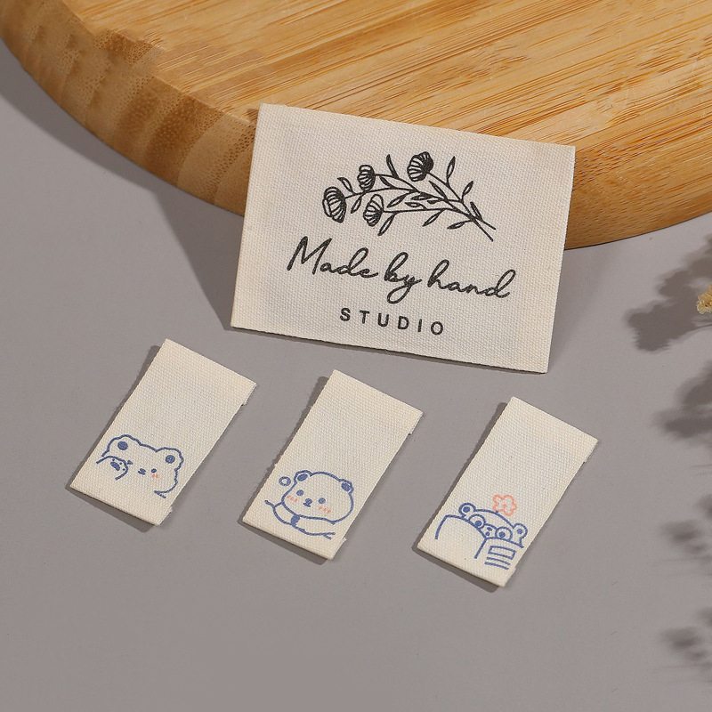 カスタムプリントプライベートロゴラベル、縫い付けコットンラベ - Baby Clothing Organic Cotton のレビューと価格
